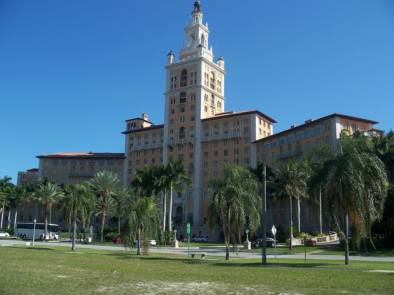 The Biltmore Hotel’s tall tower rising above palms and lawns in Coral Gables