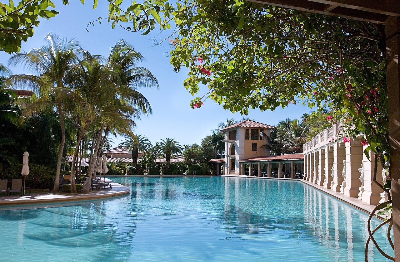 The Biltmore Hotel tower rises above its large outdoor swimming pool, photographed in 2010