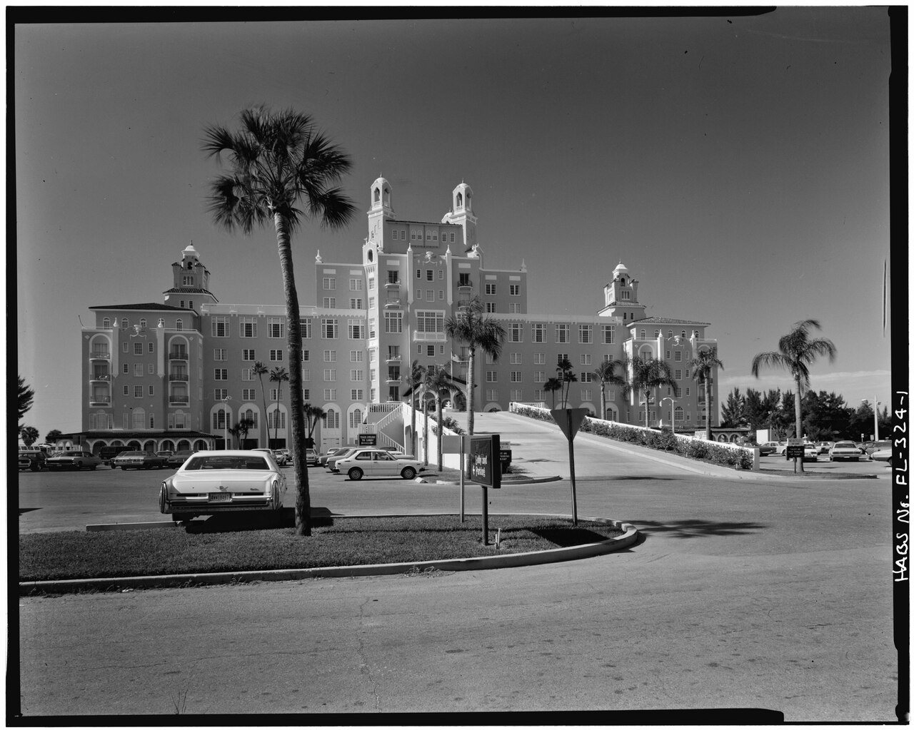 Black-and-white Historic American Buildings Survey photograph of The Don CeSar’s east front, approach ramp and parked cars
