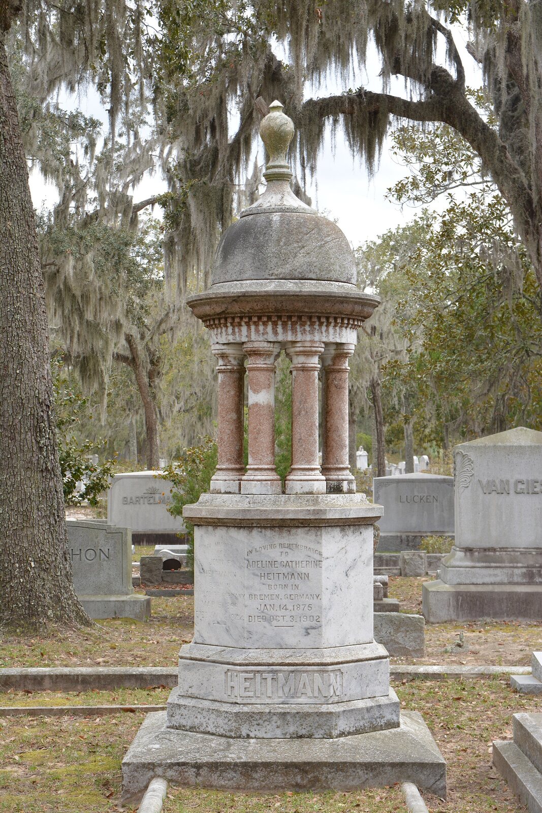 Weathered memorials among trees in Bonaventure Cemetery, Savannah