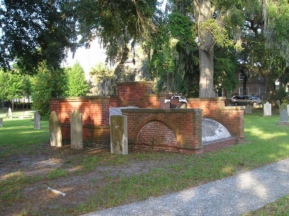 Historic graves and brick wall in Colonial Park Cemetery, Savannah